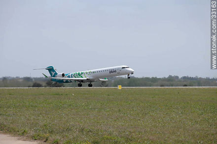 Pluna's Bombardier plane taking off - Department of Canelones - URUGUAY. Photo #33163
