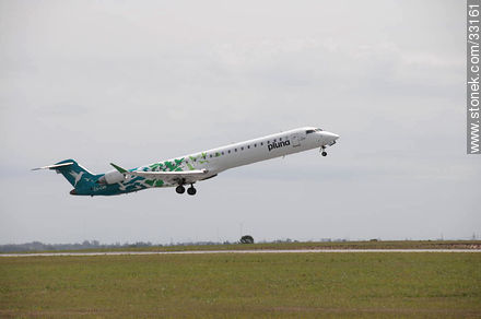 Pluna's Bombardier plane taking off - Department of Canelones - URUGUAY. Photo #33161
