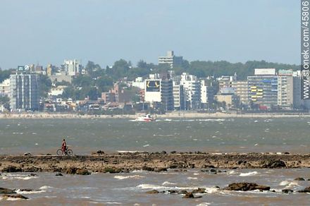 Cyclist on a breakwater - Department of Montevideo - URUGUAY. Photo #45806