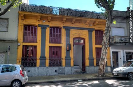 Hostel painted in orange, gray and bordeaux - Department of Montevideo - URUGUAY. Photo #50430