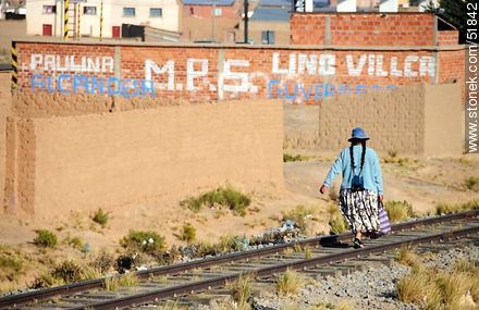 Bolivian Peasant walking along railroad tracks - Bolivia - Others in SOUTH AMERICA. Photo #51842