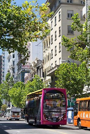 Tourist bus traveling along Avenida 18 de Julio. - Department of Montevideo - URUGUAY. Photo #56070