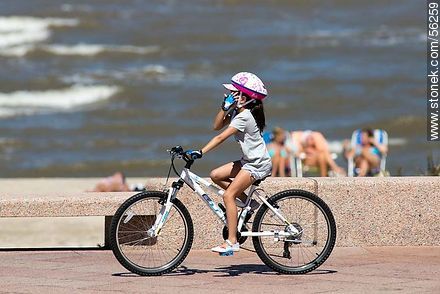 Girl cyclist with helmet - Department of Montevideo - URUGUAY. Photo #56259
