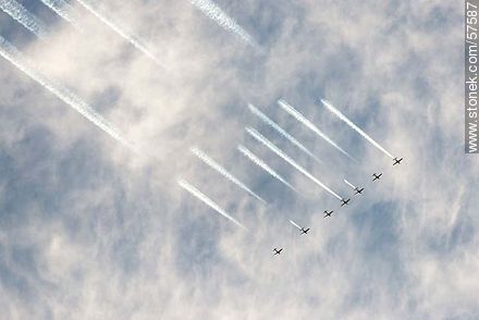 Aerobatics flight formation of the Brazilian Fumaça Escuadrilha Squadron airplanes writing in the sky with smoke - Department of Montevideo - URUGUAY. Photo #57587