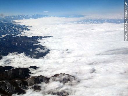 The Andes Mountains with snowy peaks in a sea of ​​clouds - Chile - Others in SOUTH AMERICA. Photo #63341
