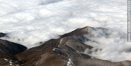 The Andes Mountains with snowy peaks in a sea of ​​clouds - Chile - Others in SOUTH AMERICA. Photo #63339