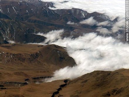 The Andes Mountains with snowy peaks in a sea of ​​clouds - Chile - Others in SOUTH AMERICA. Photo #63338