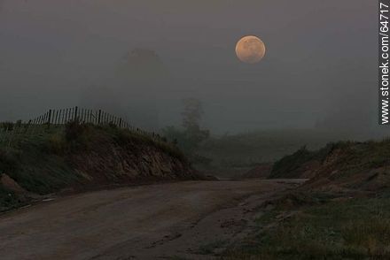 Full moon on the field at sunrise -  - MORE IMAGES. Photo #64717