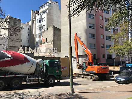 Concrete mixer and backhoe at the beginning of a construction site - Department of Montevideo - URUGUAY. Photo #67594