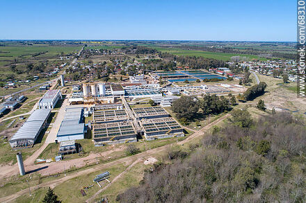 Aerial view of the town and OSE's water treatment plant - Department of Canelones - URUGUAY. Photo #68310