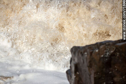 The sea breaking in a big wave over the rocks. - Department of Maldonado - URUGUAY. Photo #71261