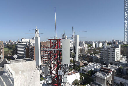 Cell phone antennas on top of a building -  - MORE IMAGES. Photo #71922