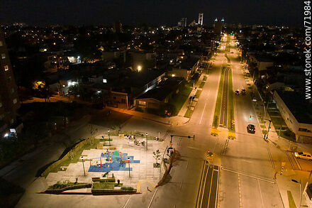 Aerial night view of the Miguel Hernandez plaza over L. A. de Herrera Ave. - Department of Montevideo - URUGUAY. Photo #71984