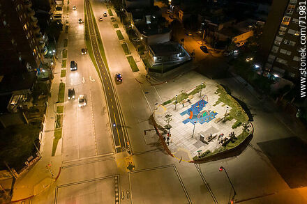 Aerial night view of the Miguel Hernandez plaza over L. A. de Herrera Ave. - Department of Montevideo - URUGUAY. Photo #71981