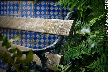 Bench next to a tiled well -  - MORE IMAGES. Photo #72123