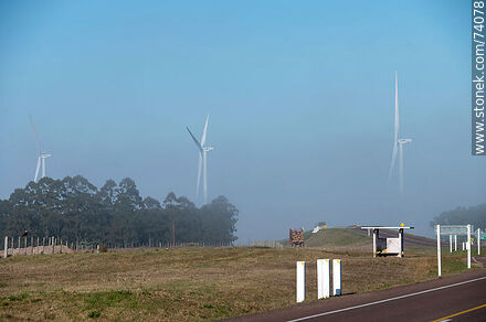 Wind turbines emerging from the morning fog near the Pampa station on Route 5. - Tacuarembo - URUGUAY. Photo #74078