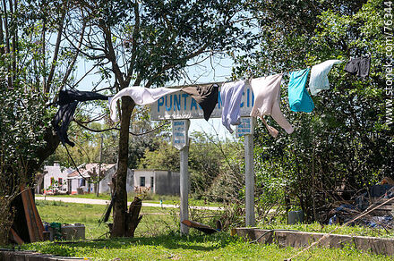 Puntas de Maciel train station. Station sign covered by drying clothes. - Department of Florida - URUGUAY. Photo #76344