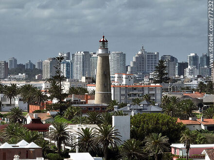 Aerial view of the lighthouse between the surrounding buildings and the distant ones - Punta del Este and its near resorts - URUGUAY. Photo #77232