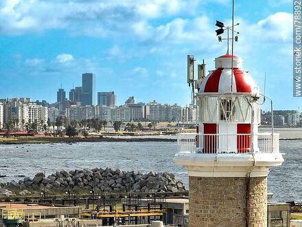 Aerial photo of Punta Carretas lighthouse with Pocitos buildings and Buceo towers in the background - Department of Montevideo - URUGUAY. Photo #78892