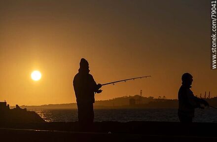 Backlit fishermen in Punta Carretas at sunset - Department of Montevideo - URUGUAY. Photo #79041
