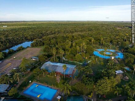 Aerial view of Termas del Daymán. Hotels and cabins. Pools and the Daymán river - Department of Salto - URUGUAY. Photo #81375