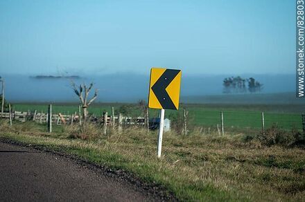 Signs of upcoming curve on the road - Department of Rivera - URUGUAY. Photo #82803