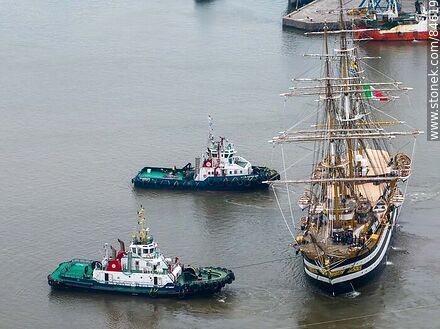 Aerial view of tugboats maneuvering with the training ship Amerigo Vespucci - Department of Montevideo - URUGUAY. Photo #84619