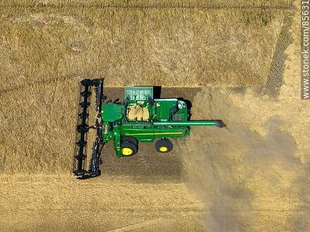 Aerial view of a combine harvester harvesting and threshing barley -  - URUGUAY. Photo #85631