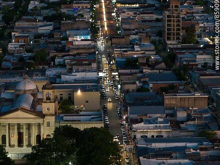 Aerial view of the Basilica Nuestra Señora del Rosario and 18 de Julio street at dusk - Department of Paysandú - URUGUAY. Photo #85909