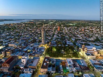 Aerial view of the city of Paysandu at sunset. Plaza Constitución, the basilica and the Torre de la Defensa. - Department of Paysandú - URUGUAY. Photo #85912