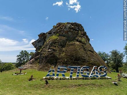 Aerial view of the Piedra Pintada. Artigas sign at the foot of the stone - Artigas - URUGUAY. Photo #85945