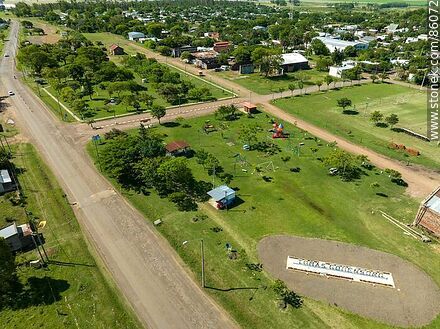 Aerial view of the Tomás Gomensoro sign next to the old railroad station - Artigas - URUGUAY. Photo #86072