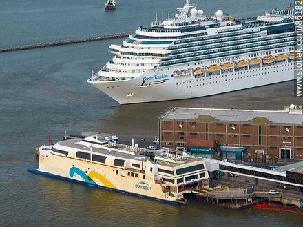 Aerial view of the catamaran Francisco and the cruise ship Costa Favolosa departing from the port - Department of Montevideo - URUGUAY. Photo #86182