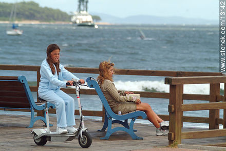 A scooter with a seat and an electric motor - Punta del Este and its near resorts - URUGUAY. Photo #13142